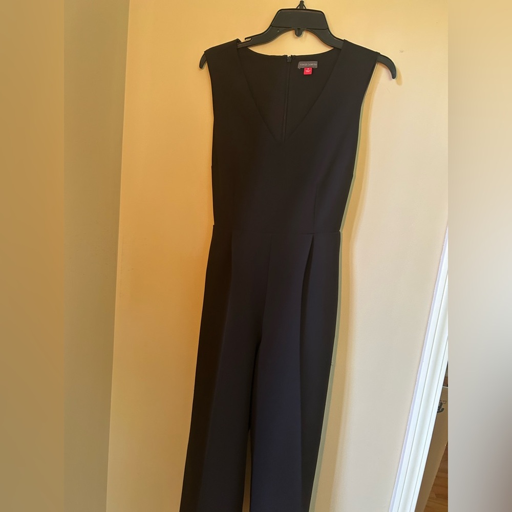 Classic Vince Camuto black jumpsuit with a sleek V-neck and tailored fit.